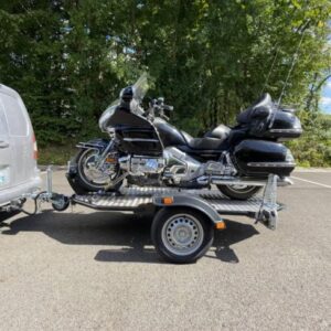 Remorque porte-moto abaissable et pliable Cochet 500 Kg